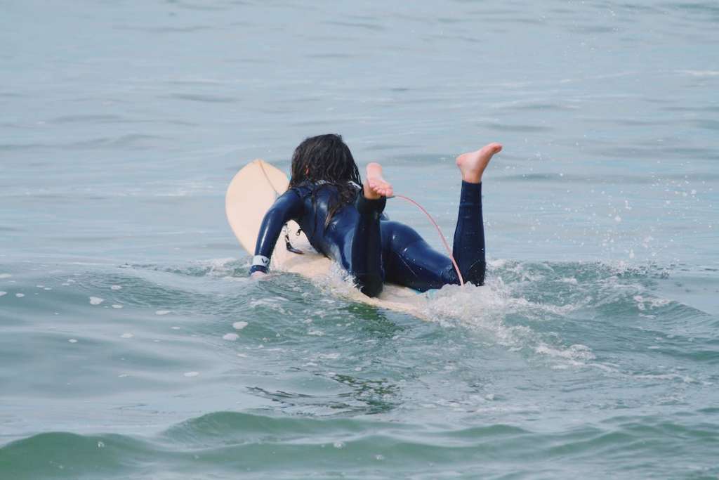 a woman on surf board 