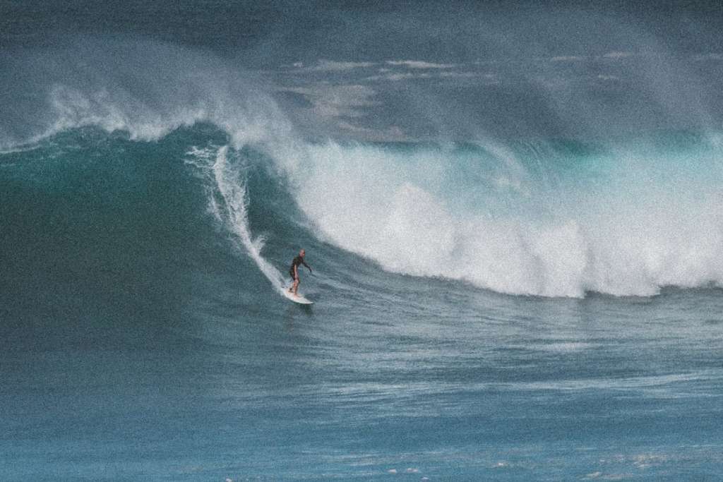 Guy riding a wave